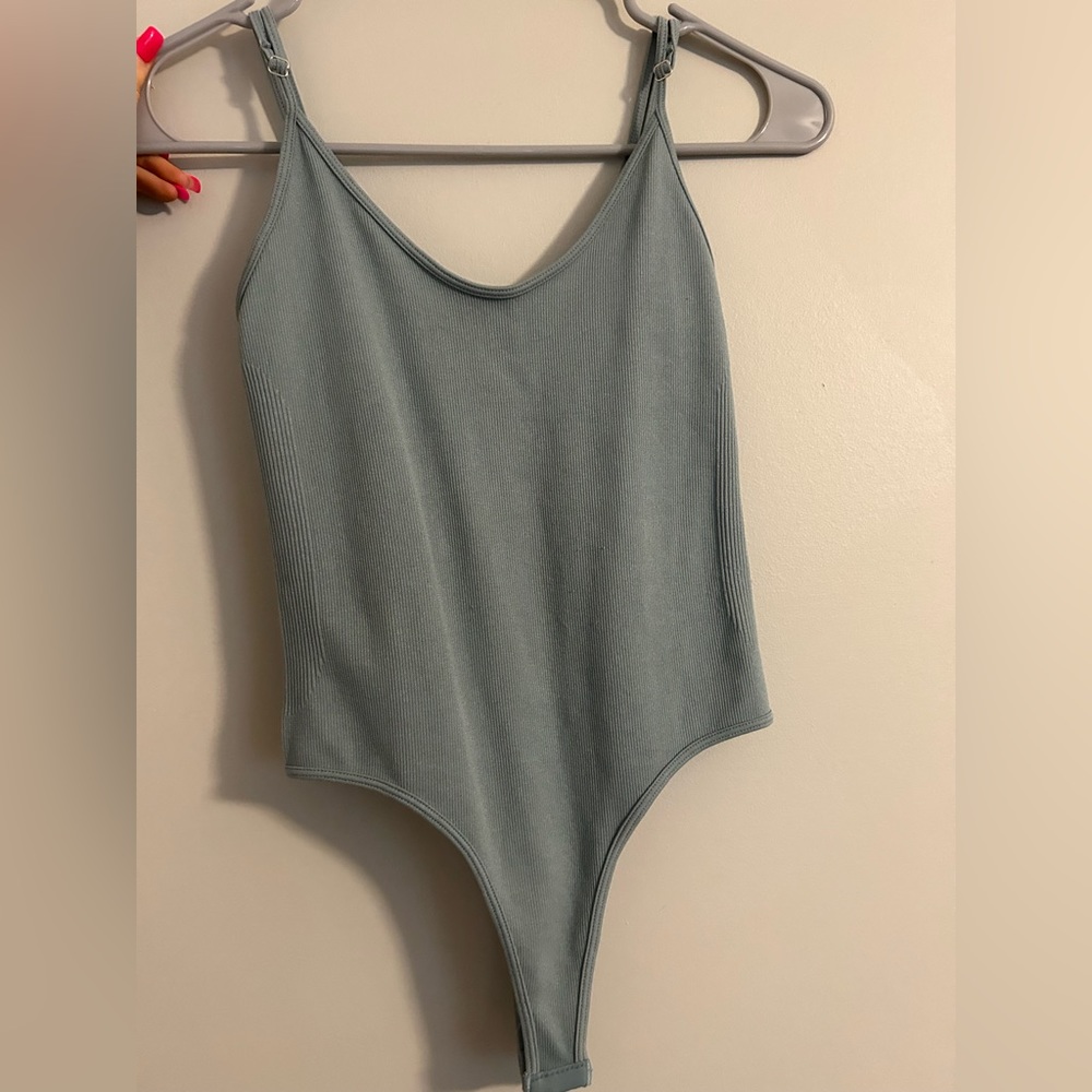 Turquoise body suit
